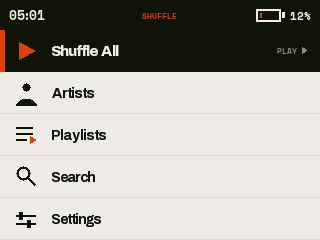 DAYLIGHT Home screen: Shuffle All selected with the PLAY hint, and the battery low and filled in the orange accent.